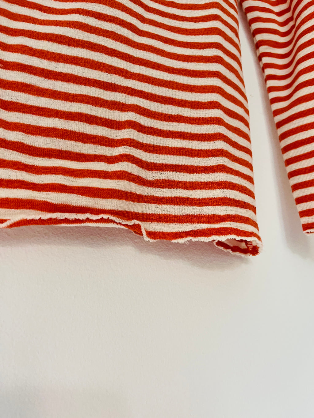 Pure merino roll-neck small-stripe orange/white