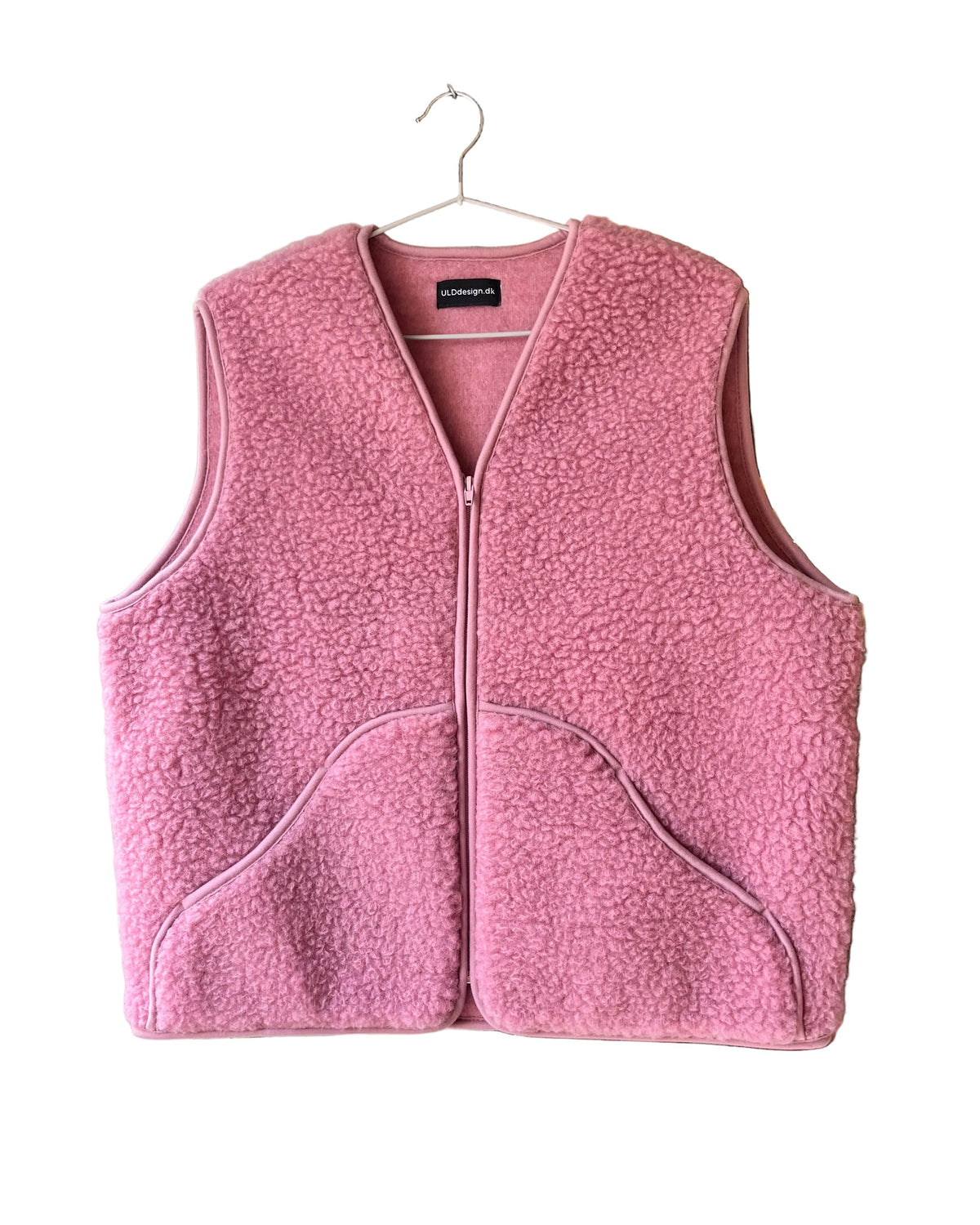 Vest i merinould med skrå lommer, rosa